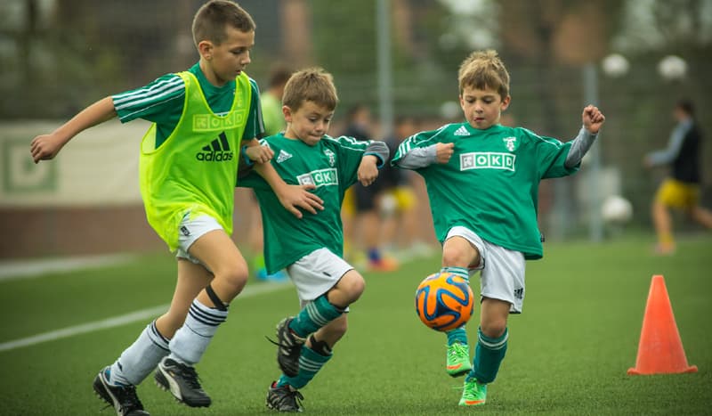 boys playing football